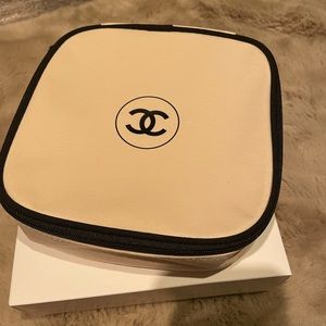 Brand new never used! Chanel cosmetic case. Tan color with the Chanel logo.